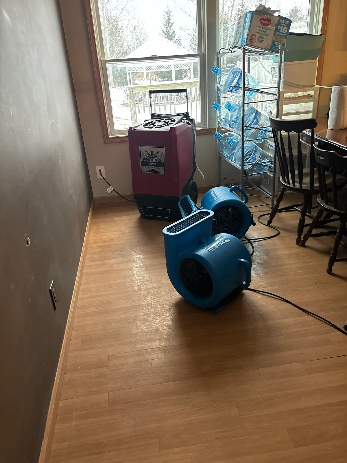 Doan Restoration air mover drying a water-damaged room in a Michigan home